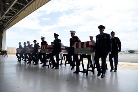Honor guards carry caskets containing the remains of American servicemen from the Korean War handed over by North Korea upon arrival at Joint Base Pearl Harbor-Hickam in Honolulu, Hawaii, U.S., August 1, 2018. PHOTO BY REUTERS/Hugh Gentry