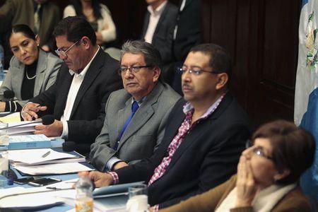 Members of an investigative commission in charge of deciding if Guatemalan President Otto Perez Molina is to be stripped of his diplomatic immunity, participate in a hearing, in Guatemala City, August 28, 2015. PHOTO BY REUTERS/Jose Cabezas