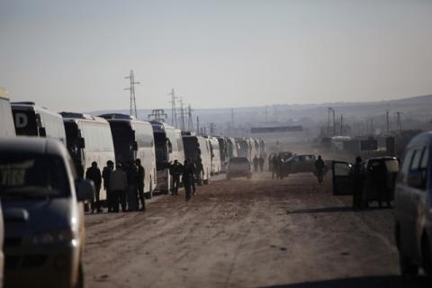 Buses carrying rebel fighters and their families who evacuated the besieged Waer district in the central Syrian city of Homs, Syria on March 19, 2017. PHOTO BY REUTERS/Khalil Ashawi