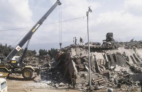 A crane is brought in after the explosion of the Marine Corps building in Beirut, Lebanon, October 23, 1983. PHOTO BY REUTERS/US Marines