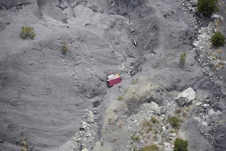 An aerial photo taken from a helicopter shows the crash site of the Germanwings Airbus A320 and its debris on the mountainside near Seyne-les-Alpes, April 3, 2015. PHOTO BY REUTERS/Lionel Bonaventure