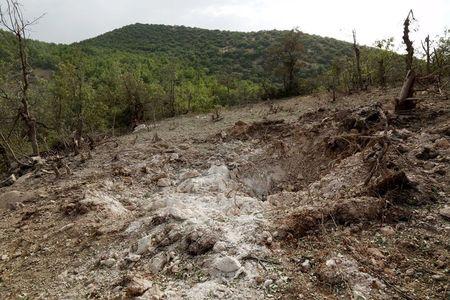 A crater caused by a Turkish air strike against Kurdistan Workers Party (PKK) camps in the village of Amadiya, outskirts of Dohuk province, July 29, 2015. PHOTO BY REUTERS/Ari Jalal
