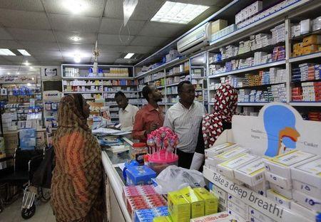 A customer buys medication at a pharmacy in Khartoum, January 13, 2013. PHOTO BY REUTERS/Mohamed Nureldin Abdallah