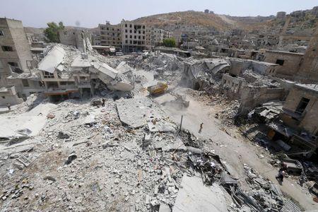 A general view shows the damage after a Syrian army fighter jet crashed into a busy marketplace in the rebel-held northwestern town of Ariha, August 3, 2015. PHOTO BY REUTERS/Ammar Abdullah