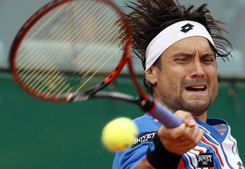 David Ferrer of Spain returns the ball to his compatriot Rafael Nadal during their quarter-final match at the Monte Carlo Masters in Monaco