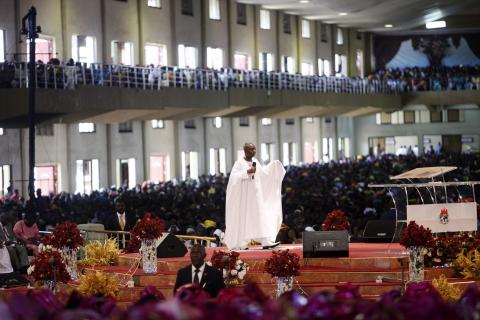 Bishop David Oyedepo (C), founder of the Living Faith Church, also known as the Winners' Chapel, conducts a service for worshippers in the auditorium of the church in Ota district, Ogun state, some 60 km (37 miles) outside Nigeria's commercial capital Lagos