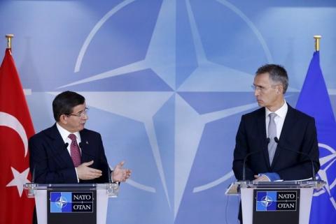 Turkish Prime Minister Ahmet Davutoglu (L) and NATO Secretary-General Jens Stoltenberg address a joint news conference at the Alliance's headquarters in Brussels, Belgium, November 30, 2015. PHOTO BY REUTERS/Francois Lenoir