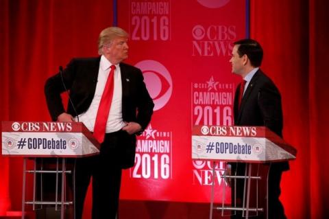 Republican U.S. presidential candidate Donald Trump (L) speaks with Senator Marco Rubio during a commercial break at the Republican U.S. presidential candidates debate sponsored by CBS News and the Republican National Committee in Greenville, South Carolina, February 13, 2016. PHOTO BY REUTERS/Jonathan Ernst