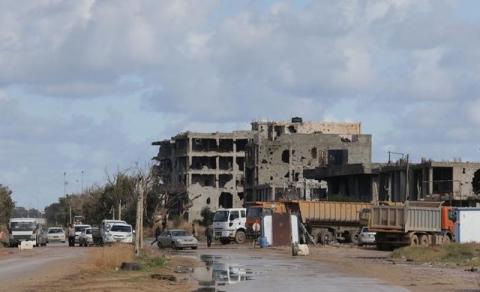 Workers clear debris to open Tripoli road that was closed during clashes between eastern-based Libyan National Army (LNA) and a coalition of Islamists and former revolutionaries, in Benghazi, Libya, January 30, 2017. PHOTO BY REUTERS/Esam Omran Al-Fetori