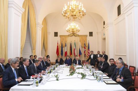 Delegations of U.S. Secretary of State John Kerry, Britain's Foreign Secretary Philip Hammond, Russian Foreign Minister Sergei Lavrov, Iranian Foreign Minister Javad Zarif, German Foreign Minister Frank-Walter Steinmeier, French Foreign Minister Laurent Fabius, EU High Representative Catherine Ashton, Chinese Foreign Minister Wang Yi sit around the negotiations table during their meeting in Vienna, November 24, 2014. PHOTO BY REUTERS/Joe Klamar