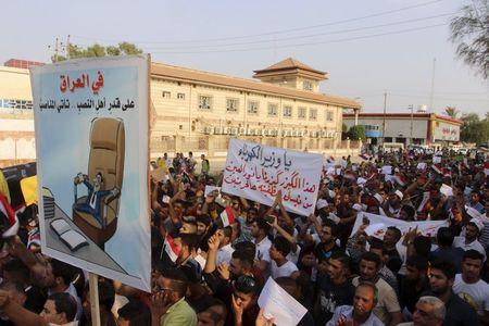 Iraqis shout slogans during a demonstration against power cuts amid an intense heatwave and protesting against what they call corruption and poor services, in Amara, southeast of Baghdad, August 4, 2015. PHOTO BY REUTERS/Essam Al-Sudani