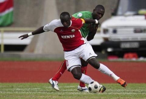 Kenya's Dennis Oliech (L) dribbles against Malawi's Moses Chavula during their African qualifier soccer match for the 2014 World Cup in Brazil, in Nairobi, June 2, 2012. PHOTO BY REUTERS/Noor Khamis