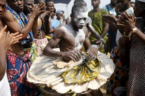 A devotee is cheered as he dances at the annual voodoo festival in Ouidah, January 10, 2016. PHOTO BY REUTERS/Akintunde Akinleye