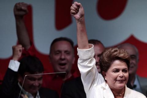 Brazil's President and Workers' Party (PT) presidential candidate Dilma Rousseff celebrates during news conference after disclosure of the election results, in Brasilia, October 26, 2014. PHOTO BY REUTERS/Ueslei Marcelino