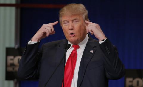 Republican U.S. presidential candidate businessman Donald Trump gestures as he speaks at the Fox Business Network Republican presidential candidates debate in North Charleston, South Carolina, January 14, 2016. PHOTO BY REUTERS/Chris Keane