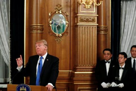 Waiters hold U.S. President Donald Trump's Diet Coke as he delivers remarks before his toast to Japan's Prime Minister Shinzo Abe during an official dinner in Trump's honor at Akasaka Palace in Tokyo, Japan November 6, 2017. PHOTO BY REUTERS/Jonathan Ernst
