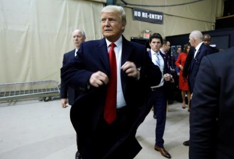 Donald Trump arrives at the Republican caucus site at the 7 Flags Event Center in Clive, Iowa, February 1, 2016. PHOTO BY REUTERS/Jim Bourg