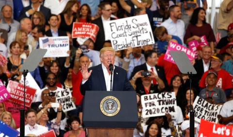 U.S. President Donald Trump speaks during his "Make America Great Again" rally at Orlando Melbourne International Airport in Melbourne, Florida, U.S., February 18, 2017. PHOTO BY REUTERS/Kevin Lamarque