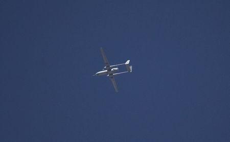 An Israeli drone flies over the West Bank city of Hebron in this June 14, 2014 file photo. PHOTO BY REUTERS/Ronen Zvulun