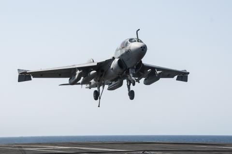 An EA-6B Prowler attached to the Garudas of Electronic Attack Squadron (VAQ) 134 lands aboard the aircraft carrier USS George H.W. Bush (CVN 77) after conducting strike missions against the Islamic State of Iraq and the Levant (ISIL), also known as the Islamic State, targets, in the Gulf