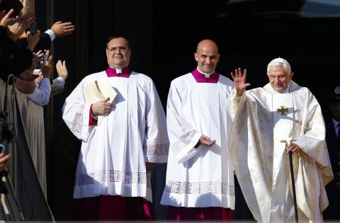 Emeritus Pope Benedict XVI waves as he arrives to attend a mass for the beatification of former pope Paul VI in St. Peter's square at the Vatican October 19, 2014. PHOTO BY REUTERS/Tony Gentile