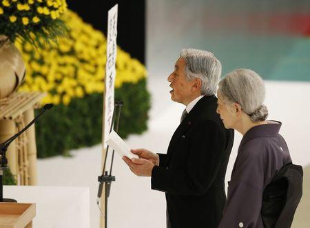 Japan's Emperor Akihito (L) delivers a speech next to Empress Michiko after they offer a moment of silence to the war dead during a memorial service ceremony marking the 70th anniversary of Japan's surrender in World War Two at Budokan Hall in Tokyo, August 15, 2015. PHOTO BY REUTERS/Toru Hanai