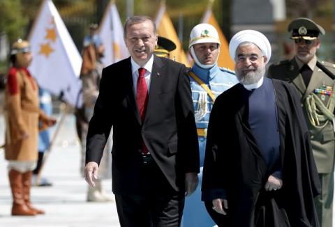 Turkish President Tayyip Erdogan (L) is seen with his Iranian counterpart Hassan Rouhani during a welcoming ceremony at the Presidential Palace in Ankara, Turkey. April 16, 2016. PHOTO BY REUTERS/Murat Cetinmuhurdar