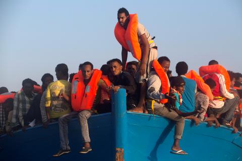 Migrants from Eritrea are seen on an overcrowded wooden vessel during a rescue operation by the Spanish NGO Proactiva, off the Libyan coast in Mediterranean Sea, August 29, 2016. PHOTO BY REUTERS/Giorgos Moutafis