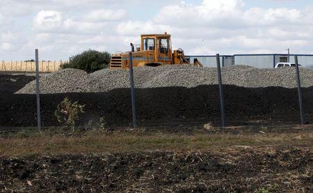 An excavator is seen at a construction site for Russia's new military base near the Russian-Ukrainian border in the village of Soloti, southeast of Belgorod, Russia, September 7, 2015. PHOTO BY REUTERS/Anton Zverev