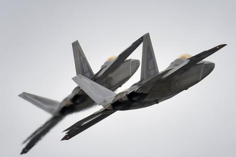 Two F-22 Raptor fighter jets from the 3rd Wing at Joint Base Elmendorf-Richardson, Alaska, conduct approach training, March 24, 2016. PHOTO BY REUTERS/Justin Connaher