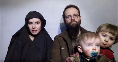 A still image from a video posted by the Taliban on social media on December 19, 2016 shows American Caitlan Coleman (L) speaking next to her Canadian husband Joshua Boyle and their two sons. PHOTO BY REUTERS/Courtesy Taliban/Social media