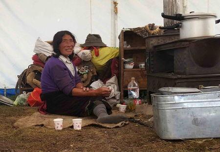 A Tibetan herdsman rests at her tent in Aba Tibetan and Quango Autonomous Prefecture, Sichuan province, August 1, 2015. PHOTO BY REUTERS/Natalie Thomas