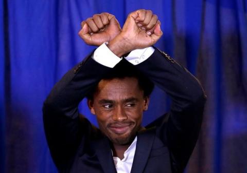 Rio Olympic marathon silver medal winner Feyisa Lilesa of Ethiopia arrives at a news conference in Washington, U.S., September 13, 2016. PHOTO BY REUTERS/Gary Cameron