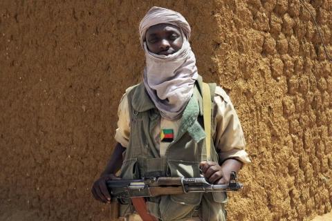 A fighter with the Tuareg separatist group MNLA (National Movement for the Liberation of Azawad) stands guard outside the local regional assembly, in Kidal, June 23, 2013. PHOTO BY REUTERS/Adama Diarra