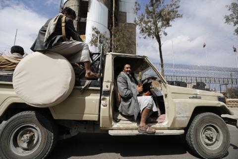 Shi'ite Houthi fighters ride a truck outside the house of Sunni tribal leader, Sheikh Sadiq al-Ahmar in Sanaa, November 26, 2014. PHOTO BY REUTERS/Khaled Abdullah
