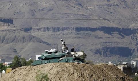 Houthi fighters sit on a tank near the Presidential Palace in Sanaa, March 25, 2015. PHOTO BY REUTERS/Khaled Abdullah