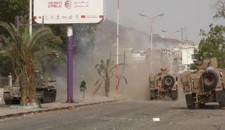 Military vehicles of the Southern Resistance fighters move during clashes with Houthi fighters on a street in Yemen's southern port city of Aden, July 17, 2015. PHOTO BY REUTERS/Stringer