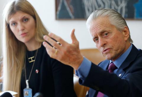 Beatrice Fihn, Executive Director of the International Campaign to Abolish Nuclear Weapons (ICAN) and U.S. actor and U.N. Messenger for Peace Michael Douglas attend a news conference on nuclear disarmament a the United Nations European headquarters in Geneva, Switzerland May 12, 2016. PHOTO BY REUTERS/Denis Balibouse