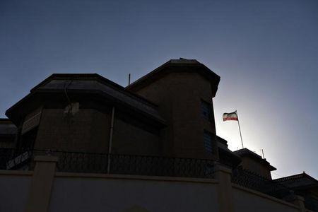 A Iranian flag flutters in the winds at the Iranian ambassador's residence in Sanaa, January 18, 2014. PHOTO BY REUTERS/Mohamed al-Sayaghi