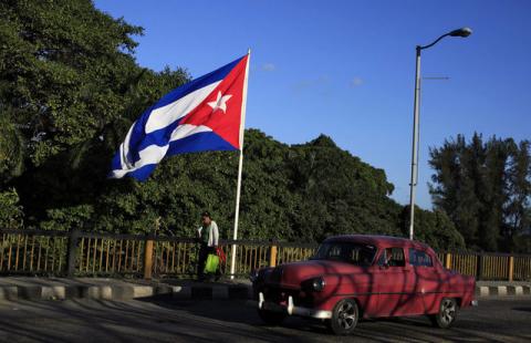 A Cuban flag flies over 'Almendares' bridge in Havana, Cuba, February 26, 2016. PHOTO BY REUTERS/Enrique de la Osa