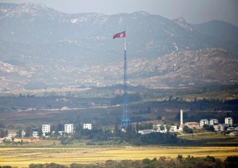 A North Korean flag is seen on top of a tower near the truce village of Panmunjom in the demilitarised zone (DMZ) separating North Korea from South Korea, about 55 km (34 miles) north of Seoul, September 25, 2013. PHOTO BY REUTERS/Lee Jae-Won