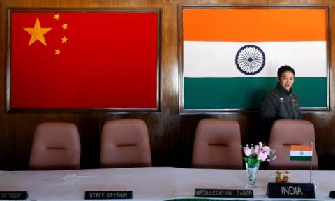 A man walks inside a conference room used for meetings between military commanders of China and India, at the Indian side of the Indo-China border at Bumla, in the northeastern Indian state of Arunachal Pradesh, November 11, 2009. PHOTO BY REUTERS/Adnan Abidi