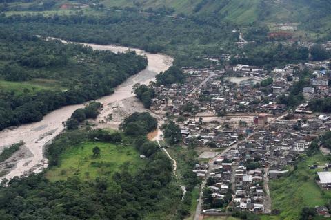 An aerial view shows a flooded area after heavy rains caused several rivers to overflow, pushing sediment and rocks into buildings and roads in Mocoa, Colombia, April 1, 2017. PHOTO BY REUTERS/Cesar Carrion/Colombian Presidency