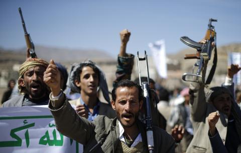 Followers of the Houthi movement shout slogans during a gathering to show support to the movement outside the Presidential Palace in Sanaa, February 4, 2015. PHOTO BY REUTERS/Khaled Abdullah