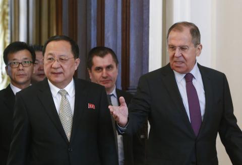 Russia's Foreign Minister Sergei Lavrov shows the way to his North Korean counterpart Ri Yong Ho (L, front) during a meeting in Moscow, Russia, April 10, 2018. PHOTO BY REUTERS/Sergei Karpukhin
