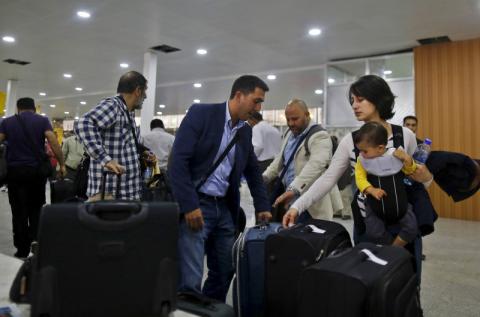 Foreigners wait for their flights as they prepare to leave Yemen via Sanaa Airport, March 28, 2015. PHOTO BY REUTERS/Khaled Abdullah