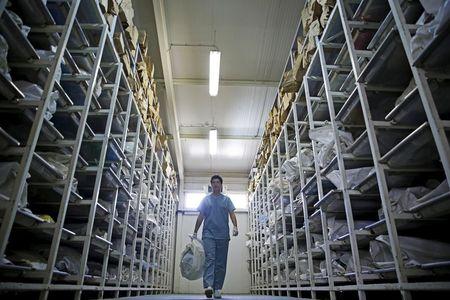 Senior Forensic Anthropologist Dragana Vucetic of the International Commission on Missing Persons (ICMP) walks during a day at work to attempt to identify the remains of a victim of the Srebrenica massacre, at the ICMP centre near Tuzla, Bosnia and Herzegovina, June 11, 2015. PHOTO BY REUTERS/Dado Ruvic