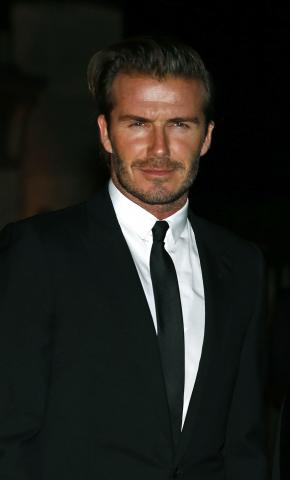 Former England soccer captain David Beckham arrives for a London Fashion Week event to celebrate the Global Fund in London