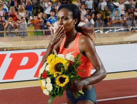 Genzebe Dibaba of Ethiopia celebrates her victory and a new world record in the 1500 meters women event at the IAAF Diamond League Herculis meeting at the Louis II Stadium in Monaco, July 17, 2015. PHOTO BY REUTERS/Jean-Pierre Amet