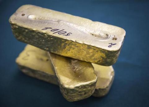 Gold alloy bars are seen at Altyntau gold mine extraction factor